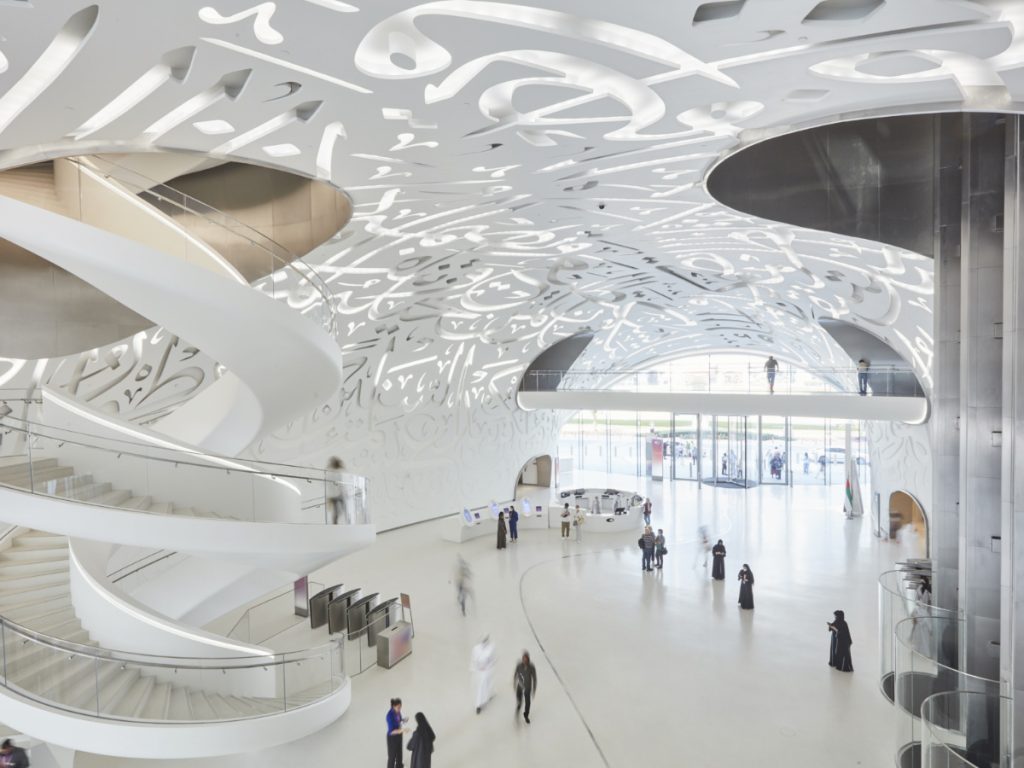 Museum of the Future atrium with curved staircases and calligraphy-perforated shell